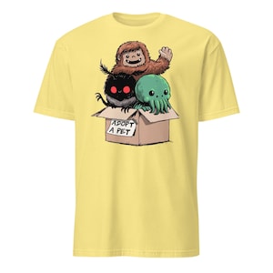 Adopt a Cryptid Shirt Funny Bigfoot Gifts for Monster Hunter Weird Stuff Folk Horror Shirt Cornsilk