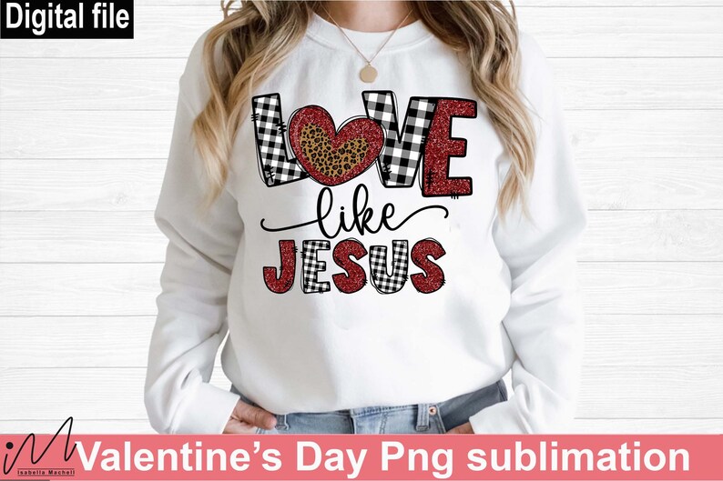 May include: White sweatshirt with the text "LOVE like JESUS". The word "LOVE" is in black and white checkered pattern with a leopard print heart. The word "JESUS" is in a black and white checkered pattern with red glitter.