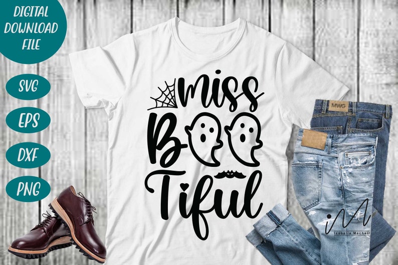 May include: White t-shirt with the phrase "miss Boo-tiful" in black script and two ghost illustrations. The shirt is paired with blue jeans and brown leather shoes, suggesting a Halloween theme.