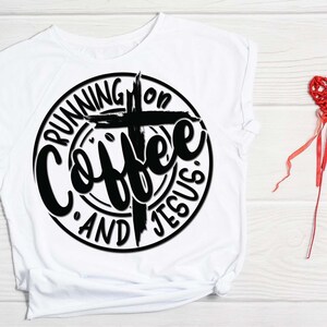 May include: White t-shirt with a black circle design that says "Running on Coffee and Jesus" with a cross in the center.