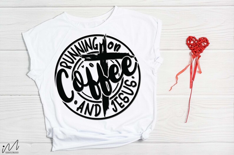 May include: White t-shirt with a black circle design that says "Running on Coffee and Jesus" with a cross in the center.
