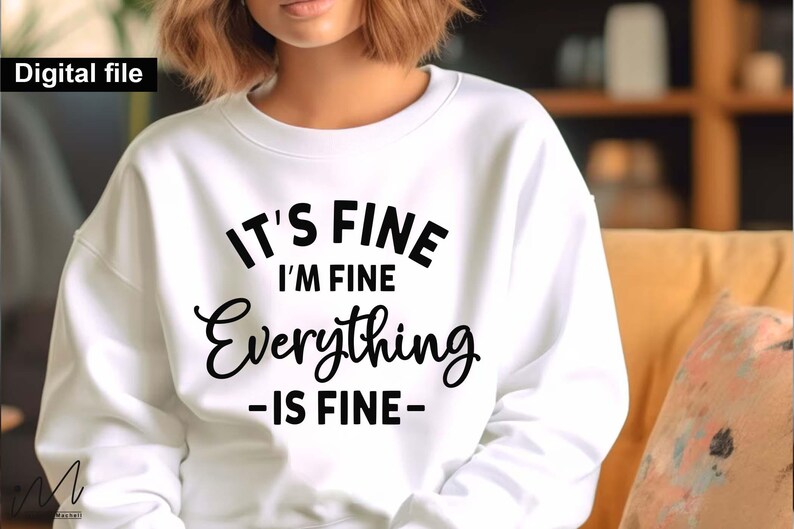 May include: A white crewneck sweatshirt featuring black text that reads IT'S FINE I'M FINE Everything -IS FINE- printed on the front. The garment has long sleeves and a ribbed neckline. The text is displayed in a mix of bold block and script fonts.
