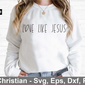 May include: White sweatshirt with the text "LOVE LIKE JESUS" in black lettering. The text includes a small heart symbol.