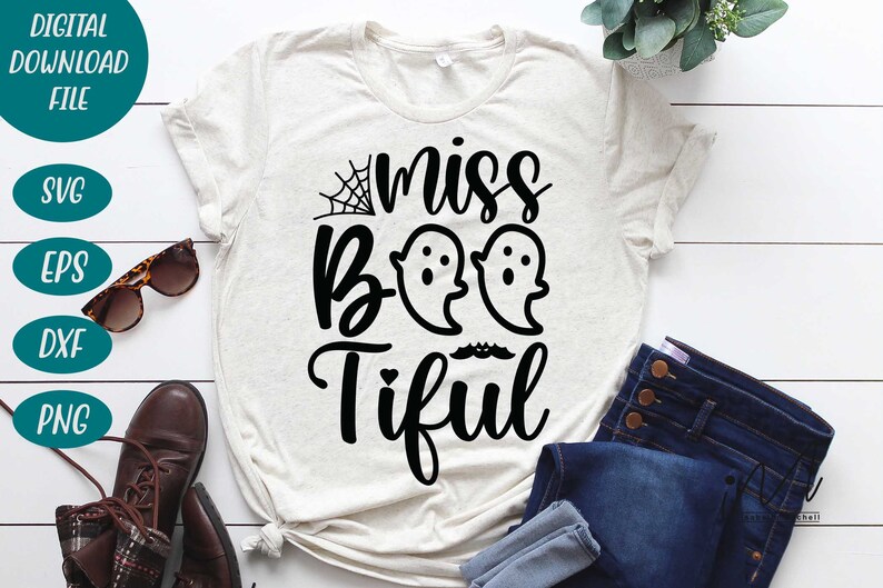 May include: A light-colored t-shirt with the words "miss Boo-tiful" in black script, featuring two ghost illustrations and a spiderweb. The shirt is part of a digital download file, with SVG, EPS, DXF, and PNG file formats.