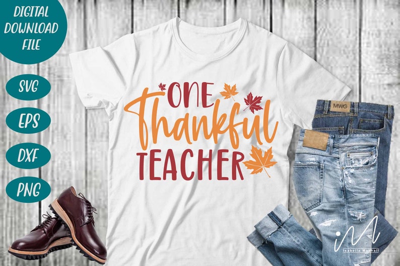 May include: White t-shirt with the text "One Thankful Teacher" in orange and red lettering.  The text is surrounded by small orange and red maple leaves.