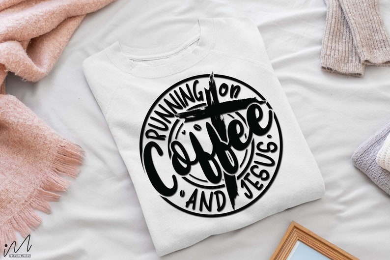 May include: White sweatshirt with a black circle design that says "Running on Coffee and Jesus" with a cross in the center.