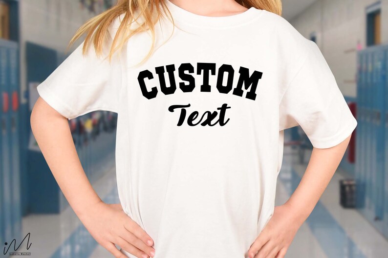 May include: White t-shirt with black text that says "CUSTOM Text" in a collegiate font.