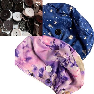 May include: An assortment of black and white buttons, along with two scrub caps. One cap is navy blue with a celestial pattern, and the other is a floral print in shades of purple and pink. Each cap has a button closure.
