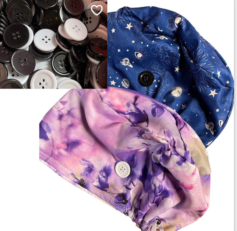 May include: An assortment of black and white buttons, along with two scrub caps. One cap is navy blue with a celestial pattern, and the other is a floral print in shades of purple and pink. Each cap has a button closure.