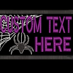 May include: Purple embroidered patch featuring a spider web and spider design. The text "CUSTOM TEXT HERE" is embroidered in purple.