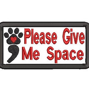 May include: A white rectangular patch with a black border. The patch has a red paw print with a red heart in the center and a black semicolon. The text "Please Give Me Space" is in red.