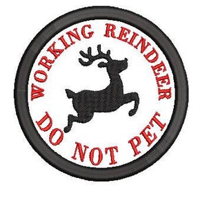 May include: A black and white round patch with red embroidered text that reads "Working Reindeer Do Not Pet". A black silhouette of a reindeer is in the center of the patch.