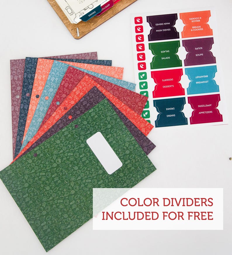 May include: A set of colorful dividers for a recipe binder. The dividers are made of cardstock and have a variety of food-themed patterns. The text "COLOR DIVIDERS INCLUDED FOR FREE" is printed on the bottom of the image.