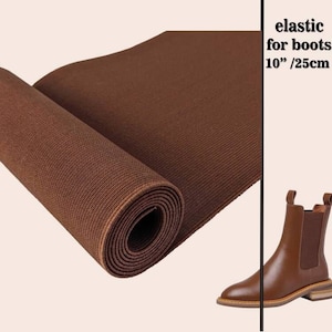 Può includere: Elastico marrone per stivali, lungo 10 pollici, arrotolato su uno sfondo bianco. L'elastico è lungo 10 pollici / 25 cm.