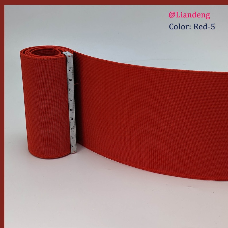 Peut inclure: Bande &eacute;lastique rouge enroul&eacute;e avec un ruban &agrave; mesurer &agrave; c&ocirc;t&eacute;. La bande &eacute;lastique mesure 5 pouces de large. Le texte "@Liandeng Color: Red-5" est visible dans le coin sup&eacute;rieur droit de l'image.