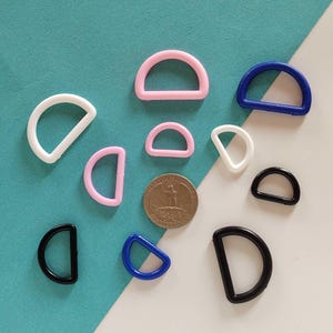 40 witte plastic D-ringen: 3/4 inch singelband