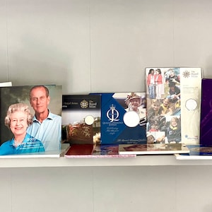 A collection of Ten various Royal Mint uncirculated coin Presentation packs including Queen Elizabeth and Queen mother