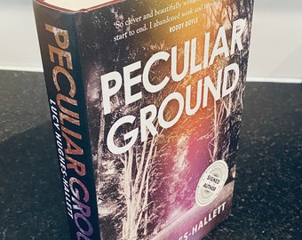 Peculiar Ground 1st edition signed hardback book by Lucy Hughes-Hallett, signed by the author to the title page. Dated 2017.