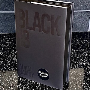 Black 13 by Adam Hamdy hardback book From a Signed and numbered limited edition of just 750 of which this is number 148. image 1
