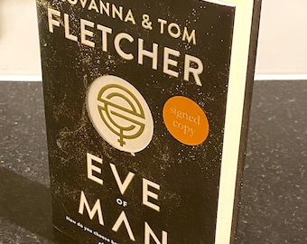 Eve of Man, libro de tapa dura firmado por Giovanna y Tom Fletcher, firmado por ambos autores y fechado en mayo de 2018.