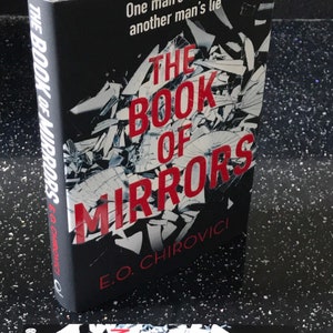 The book of mirrors by E O Chirovici. Signed  by the author . From a numbered limited edition of just 750 of which this is number 92.