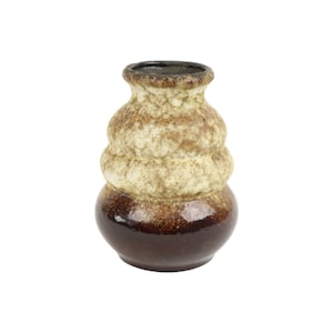 May include: A small, brown and white ceramic vase with a textured, bubbly design. The vase has a rounded, bulbous shape.