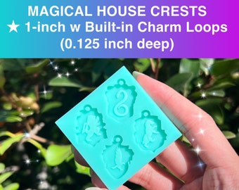 May include: A turquoise silicone mold with four 1-inch deep impressions of magical house crests. The crests include a lion, a snake, a badger, and an eagle. The mold is designed for making charms with built-in loops.