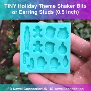 May include: A blue silicone mold with 12 different holiday-themed shapes, including a gingerbread man, Santa Claus, a nutcracker, a candy cane, and a mitten. The mold is 0.5 inches in size.