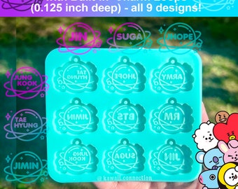 May include: A blue silicone mold with nine individual compartments for making resin charms. Each compartment features a different BTS member's name in a circle with a star design. The mold is 1 inch wide and 0.125 inch deep.