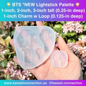 May include: A clear silicone mold for crafting BTS lightstick-shaped charms. The mold includes designs for 1-inch, 2-inch, and 3-inch tall lightsticks, plus a 1-inch charm with a loop. Text on the image reads "BTS *NEW Lightstick Palette".