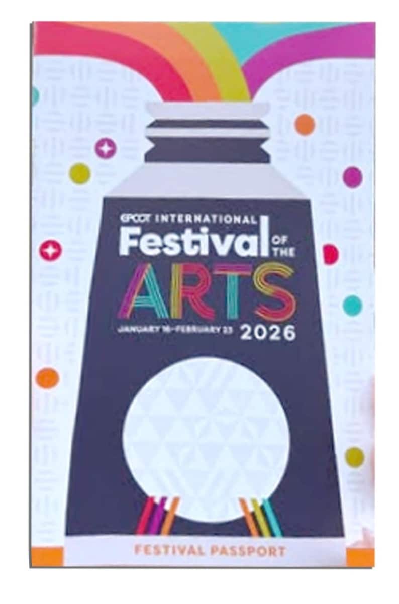 The cover of the Epcot International Festival of Arts 2026 festival passport features a large paint tube graphic with colorful streams.