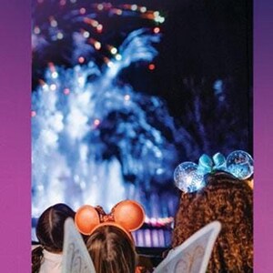 An Epcot English guidemap brochure featuring children watching fireworks with glowing fairy wings and mouse ears.