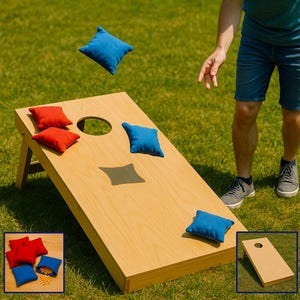 May include: A light-colored wooden cornhole board with a circular hole and several square fabric bean bags in solid red and blue colors. The bean bags are scattered on the board surface and one is captured in mid-air during a toss.