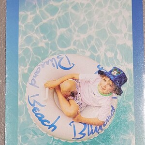 A vertical guide map brochure for Disney's Water Parks features a child in a hat floating in a tube on blue water.