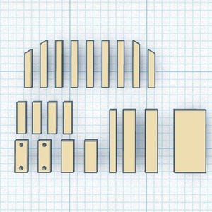 A blueprint or layout diagram on a blue grid background showing various rectangular and angled wooden pieces required for a woodworking project.