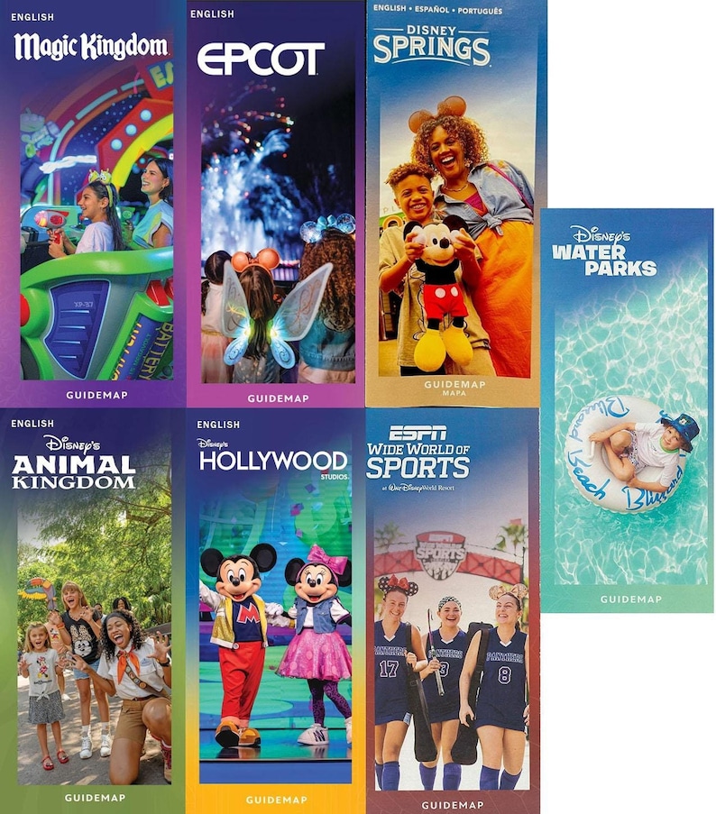A grid of seven Walt Disney World park and resort guidemap brochures laid out on a flat surface.
