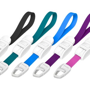 May include: Five different colored tourniquets with white plastic buckles. The colors are black, teal, blue, purple, and pink.