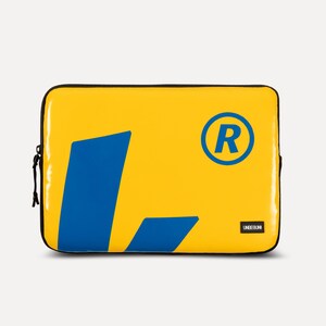 May include: Yellow laptop sleeve with a blue "L" shape and a blue circle with a white "R" inside. The sleeve has the text "UNIQEUNI" in black.