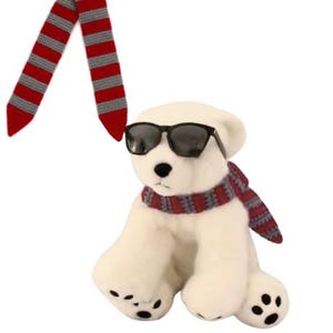 May include: A white plush polar bear wearing black sunglasses and a red and gray striped scarf. A matching red and gray striped scarf is next to the bear. The bear has black paw pads.