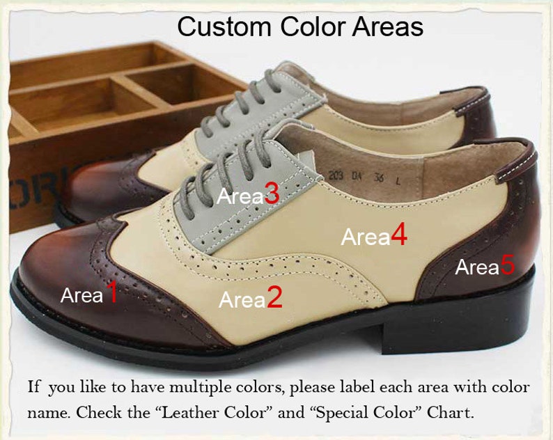 May include: A pair of brown and beige leather shoes with a wingtip design. The shoes have five different color areas that can be customized. The text "Custom Color Areas" is at the top of the image. The text "Area 1", "Area 2", "Area 3", "Area 4", and "Area 5" are labeled on the shoes.