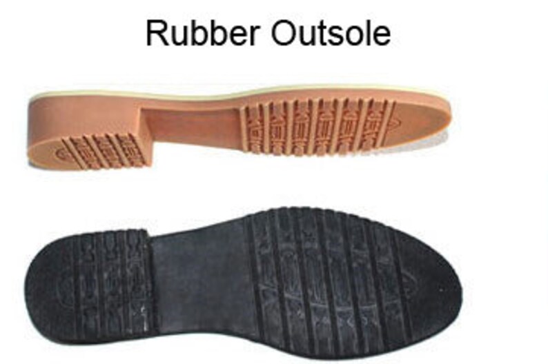 May include: Close-up of a rubber outsole for a shoe. The outsole has a textured pattern and a light brown color.
