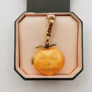 Juicy Couture peach charm