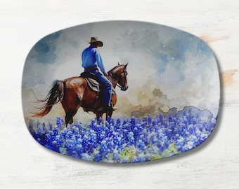 May include: A cowboy riding a brown horse through a field of bluebonnet wildflowers. The cowboy is wearing a blue shirt, jeans, and a brown cowboy hat. The background is a watercolor painting of a cloudy sky.