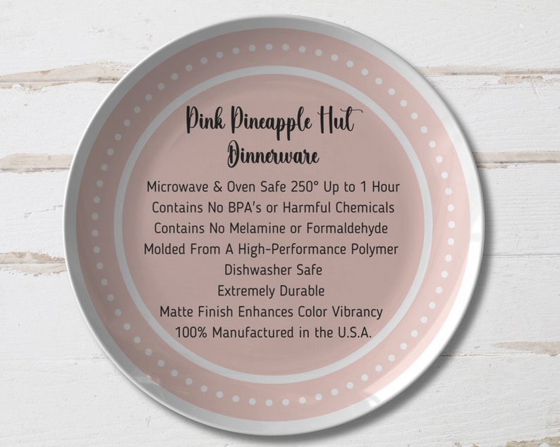 May include: A pink dinner plate with white polka dots and the text "Pink Pineapple Hut Dinnerware" in black. The plate features a list of product features, including microwave and oven safe, dishwasher safe, and made in the USA.