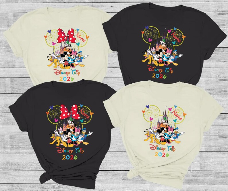 May include: Four t-shirts with a Disney theme. Each shirt features a Mickey Mouse head design with the text "Disney Trip 2026" and the option to add a name. The shirts are in black, cream, and beige.