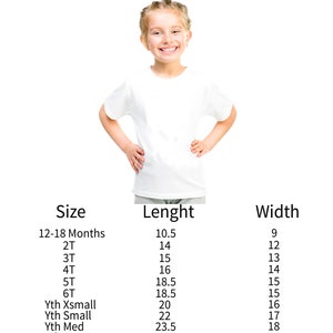May include: A white Gildan t-shirt on a young girl, with a size guide chart. The chart lists sizes from 12-18 months to Youth XLarge, with length and width measurements in inches. Care instructions: Do not bleach. Tumble dry low.