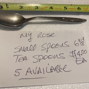 May include: Five silver tea spoons with a rose design. The spoons are 6 1/8 inches long and cost $4.00 each. My Rose small spoons 6 1/8 Tea Spoons $4.00 EA 5 AVAILABLE