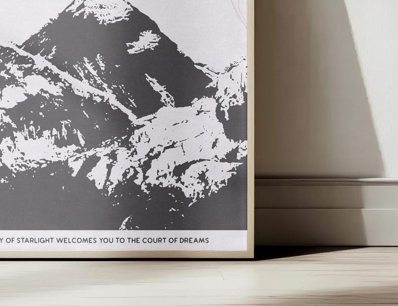 May include: A black and white illustration of a mountain range with the text "The City of Starlight Welcomes You to the Court of Dreams".
