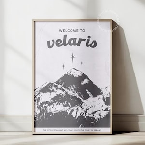 May include: A black and white print with the text "WELCOME TO velaris" and the words "THE CITY OF STARLIGHT WELCOMES YOU TO THE COURT OF DREAMS". The print features a stylised mountain range with stars above.