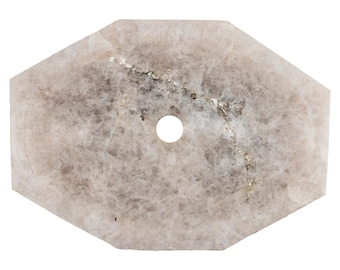 May include: A light gray octagonal shaped stone sink with a round hole in the center.